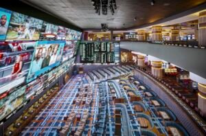 Interior of Circa Sportsbook in Las Vegas, with video wall, odds boards, seating, and gaming floor