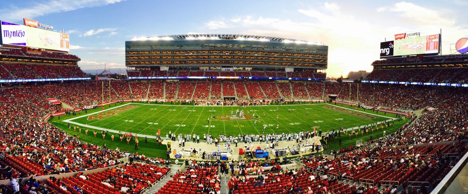 Fans at an NFL game in Levi's Stadium, photographed by Robert Hernandez Villalta via Pexels.