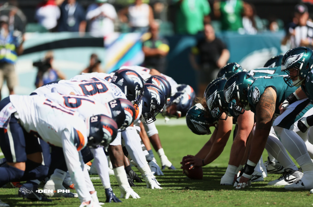 Philadelphia Eagles and Denver Broncos line up at the line of scrimmage.